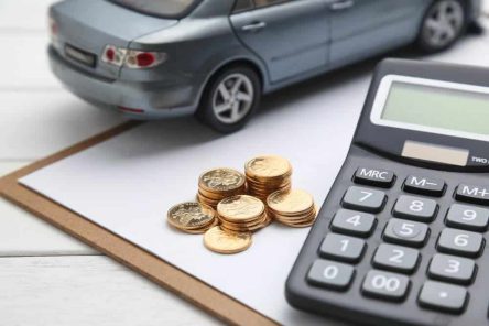 car-model-calculator-coins-white-table