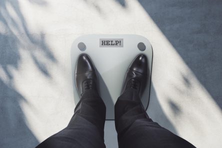 close-up-top-view-businessman-feet-scales-asking-help-lose-weight-measuring-concept (1)