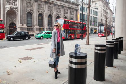 influencer-taking-selfie-using-smartphone-placed-pylon-city (1)