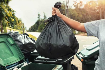 woman-hand-holding-garbage-black-bag-cleaning-trash (1)